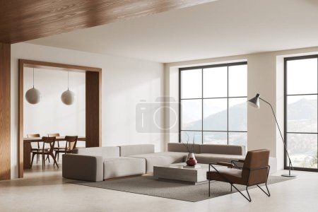 Foto de Esquina de la moderna sala de estar con paredes blancas y de madera, suelo de hormigón, cómodo sofá gris y sillón de pie cerca de la mesa de café cuadrada. renderizado 3d - Imagen libre de derechos