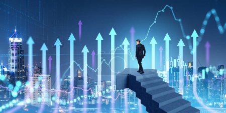Photo for Young businessman standing on stairs in night city and looking at digital graphs. Concept of stock market trading and investment - Royalty Free Image