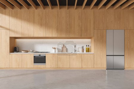 Téléchargez les photos : Intérieur d'une cuisine minimaliste élégante avec murs en bois, sol en béton, placards en bois et armoires avec évier et cuisinière intégrés et grand réfrigérateur. Rendu 3d - en image libre de droit
