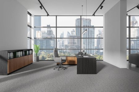 Photo for Modern office interior with pc computer on desk, armchair on carpet concrete floor. Stylish consulting work space with sideboard and panoramic window on Bangkok skyscrapers. 3D rendering - Royalty Free Image