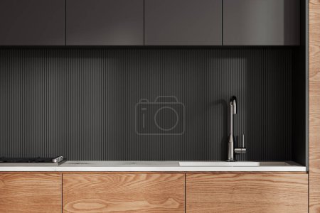 Téléchargez les photos : Intérieur de cuisine maison minimaliste avec évier et cuisinière, ustensiles de cuisine sur comptoir en pierre. Gros plan de la zone de cuisson minimaliste en bois et noir dans un appartement moderne. rendu 3D - en image libre de droit