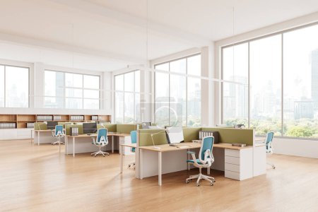 Photo for Corner view of coworking interior with pc computers on table, shelf with folders on hardwood floor. Stylish work space with panoramic window on Bangkok skyscrapers. 3D rendering - Royalty Free Image