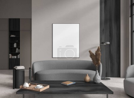 Photo for Interior of modern living room with gray and wooden walls, concrete floor, comfortable gray sofa standing near coffee table and vertical mock up poster. 3d rendering - Royalty Free Image