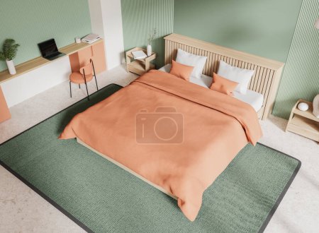 Foto de Vista superior interior del dormitorio del hotel verde con cama en alfombra, mesa de trabajo con silla y portátil, mesita de noche con decoración. Lugar de trabajo en el dormitorio moderno. Renderizado 3D - Imagen libre de derechos