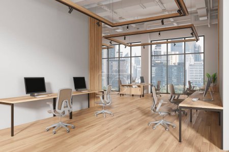 Photo for Corner view of coworking interior with pc computers on table in row, hardwood floor. Minimalist work corner with panoramic window on Bangkok skyscrapers. 3D rendering - Royalty Free Image