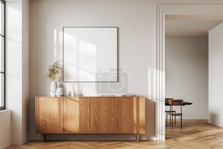 Photo for Interior of minimalistic living room with white walls, wooden floor, comfortable wooden dresser with square mock up poster hanging above it. 3d rendering - Royalty Free Image
