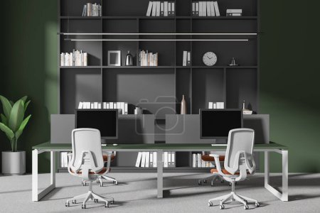 Photo for Green coworking interior with armchairs, pc computers on desk with divider. Stylish business office workplace and shelf with art decoration. 3D rendering - Royalty Free Image