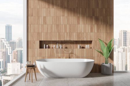 Téléchargez les photos : Intérieur de salle de bain élégante avec des murs en bois, sol carrelé et baignoire blanche confortable avec étagère au-dessus. Rendu 3d - en image libre de droit