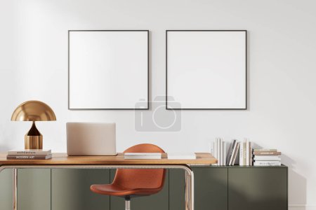 Foto de Interior de la oficina del hogar con estilo con paredes blancas, cómoda mesa de ordenador con silla naranja y dos carteles de simulacro cuadrados. renderizado 3d - Imagen libre de derechos