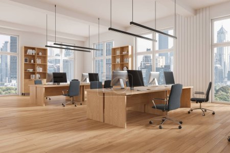 Photo for Corner view of office coworking interior with pc computers on desk in row, hardwood floor. Cozy work space with panoramic window on Bangkok skyscrapers. 3D rendering - Royalty Free Image