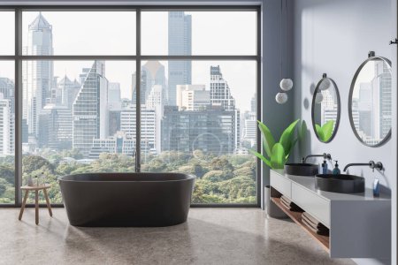 Photo for Modern hotel bathroom interior with bathtub and double sink, vanity with accessories. Bathing room in contemporary apartment, panoramic window on Bangkok skyscrapers. 3D rendering - Royalty Free Image