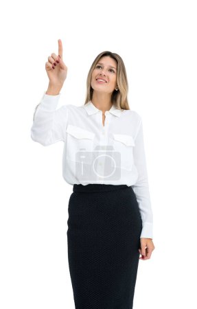 Foto de Sonriente mujer de negocios dedo toque fondo blanco aislado. Haz clic en la mano o apunta a algo. Concepto de tecnología, interfaz, control del sistema o metáfora - Imagen libre de derechos