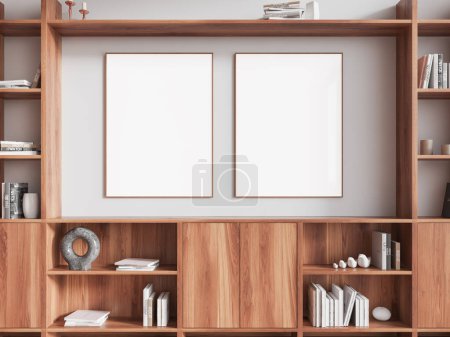 Foto de Interior de la elegante sala de estar con paredes blancas y cómoda de madera con libros y jarrones. Dos carteles verticales que cuelgan encima. renderizado 3d - Imagen libre de derechos