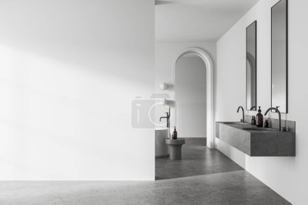 Téléchargez les photos : Élégant intérieur de la salle de bain de l'hôtel avec double lavabo et baignoire, sol en granit clair. Espace de baignade avec entrée de la porte de l'arche. Maquette copier l'espace mur vide. rendu 3D - en image libre de droit