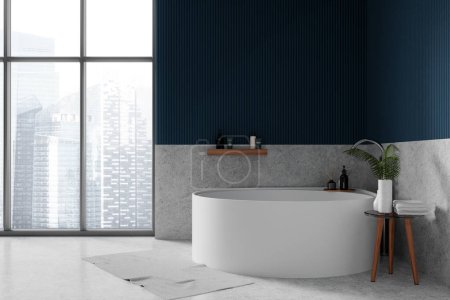 Photo for Interior of stylish bathroom with blue and gray walls, concrete floor and comfortable round bathtub standing near window. 3d rendering - Royalty Free Image