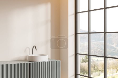 Foto de Esquina de baño moderno con paredes de color beige y cómodo fregadero redondo de pie en el mostrador gris cerca de una gran ventana con vista a la montaña. renderizado 3d - Imagen libre de derechos