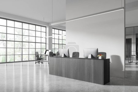 Foto de Interior de oficina moderna con paredes blancas, suelo de hormigón y escritorio de recepción de madera con dos ordenadores. renderizado 3d - Imagen libre de derechos