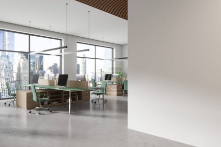 Photo for Corner view of office interior with pc computers on tables in row, concrete floor. Stylish coworking space with panoramic window on New York. Mockup copy space empty partition. 3D rendering - Royalty Free Image