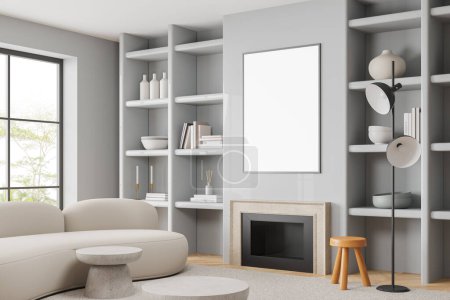 Téléchargez les photos : Coin du salon moderne avec des murs gris, sol en bois, confortable canapé blanc debout près de la cheminée et affiche maquette verticale. Rendu 3d - en image libre de droit