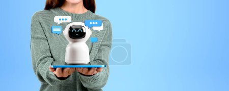 Photo for Unrecognizable young woman holding tablet with AI artificial intelligence chat bot standing over blue copy space background. Concept of machine learning - Royalty Free Image