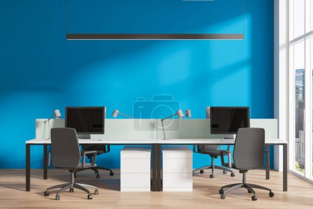 Photo for Blue office interior with pc computers on desk, drawer on hardwood floor. Stylish coworking zone with panoramic window on New York skyscrapers. 3D rendering - Royalty Free Image