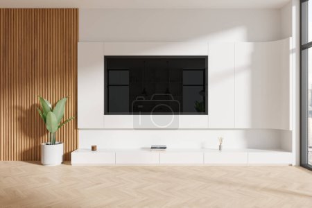 Photo for White and wooden home living room interior with tv display on wall, sideboard with art decoration on hardwood floor. Panoramic window on skyscrapers. 3D rendering - Royalty Free Image