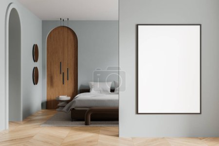 Photo for Interior of modern bedroom with gray walls, wooden floor, comfortable king size bed with two bedside tables and vertical mock up poster on the wall. 3d rendering - Royalty Free Image