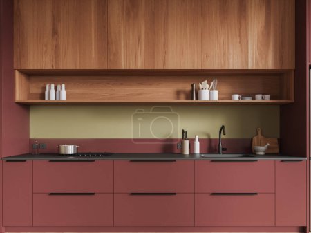 Photo for Comfortable red cabinets with built in sink and cooker and wooden cupboards standing in modern kitchen interior with green walls. 3d rendering - Royalty Free Image