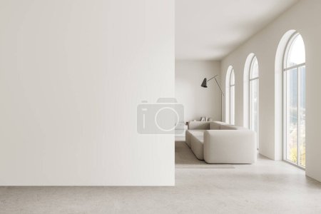 White home living room interior with sofa, shelf with decoration and carpet on concrete floor. Relax space with mock up empty wall partition. Panoramic arched window on countryside. 3D rendering