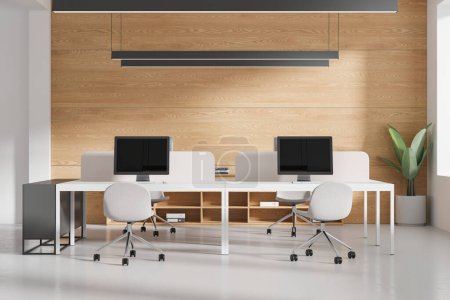 Foto de Interior de coworking blanco y madera con escritorio pc en mesas, piso de hormigón. Elegante espacio de trabajo con muebles minimalistas, estante con documentos y planta. Renderizado 3D - Imagen libre de derechos