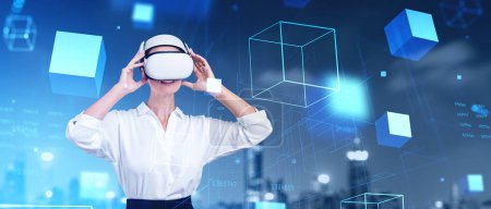 Photo for Portrait of cheerful young European woman using VR virtual reality goggles in blurry night city. Concept of metaverse and cyberspace - Royalty Free Image