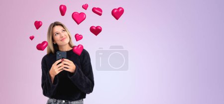 Portrait of happy young woman standing with smartphone with social media icons over purple copy space background. Concept of online communication