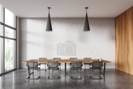 Photo for Interior of modern office meeting room with white and wooden walls, concrete floor and long conference table with black chairs. 3d rendering - Royalty Free Image