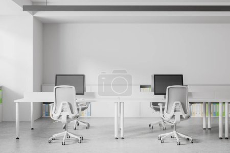 Photo for Interior of minimalistic open space office with white walls, concrete floor, row of white computer desks and gray chairs. 3d rendering - Royalty Free Image