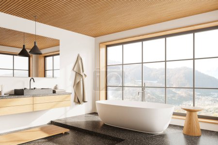 Photo for Corner view of hotel bathroom interior with sink and vanity, bathtub on grey granite floor. Bathing space and panoramic window on countryside in modern apartment. 3D rendering - Royalty Free Image