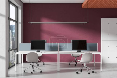 Photo for Red office interior with pc computers on desk, lockers on concrete floor. Stylish coworking zone with panoramic window on New York skyscrapers. 3D rendering - Royalty Free Image