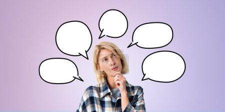 Photo for Young European businesswoman or college student with blank speech bubbles drawn around her head over purple background. Concept of opinion discussion and chatting. Brainstorming and choice - Royalty Free Image