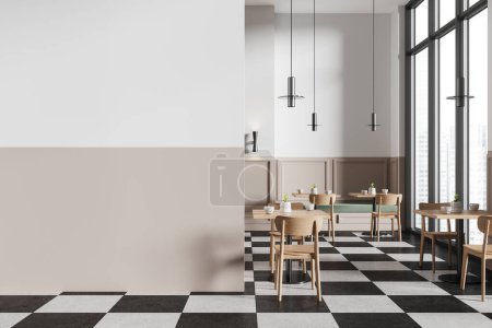 Téléchargez les photos : Intérieur d'un élégant restaurant minimaliste avec des murs blancs et beiges, des tables carrées et un sol à carreaux. Chaises en bois et canapés verts. Copier le modèle d'espace. Rendu 3d - en image libre de droit