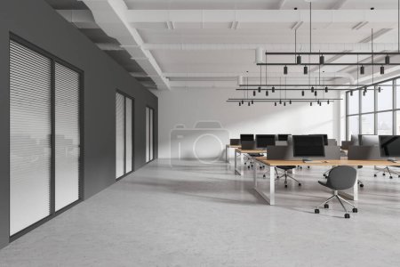 Industrial style open space office interior with gray and white walls, concrete floor, classroom or coworking with hot desks. Gray chairs along panoramic window. Education and business. 3d rendering
