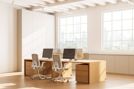 Photo for Corner view of workplace interior with pc computers on shared wooden tables, hardwood floor. Stylish workplace with panoramic window on Bangkok skyscrapers. 3D rendering - Royalty Free Image