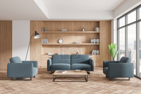 Photo for White and wooden business interior with soft place, sofa and armchairs with coffee table. Waiting or relaxing space with shelf and panoramic window on Kuala Lumpur skyscrapers. 3D rendering - Royalty Free Image