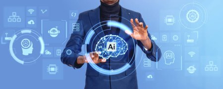 Téléchargez les photos : Les mains d'homme d'affaires noir touchent l'hologramme numérique avec le cerveau d'IA, les icônes lumineuses avec le robot de chat et les indicateurs. Concept d'intelligence artificielle et d'apprentissage automatique - en image libre de droit