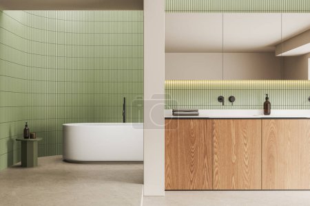 Téléchargez les photos : Intérieur coloré de la salle de bain de l'hôtel avec baignoire, lavabo et accessoires minimalistes sur la table d'appoint et la vanité. Salle de bain dans un appartement moderne avec mur de tuiles vertes et sol en béton. rendu 3D - en image libre de droit