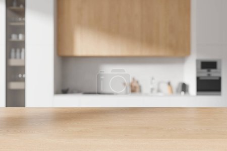 Photo for Empty wooden table on background of white and beige home kitchen interior, blurred cooking space with cabinet and kitchenware. Mock up copy space for product display. 3D rendering - Royalty Free Image