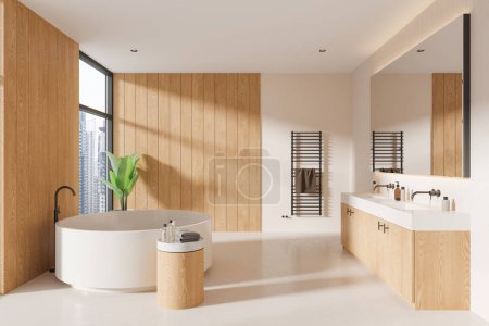 Foto de Baño interior beige y de madera con bañera redonda, doble lavabo con espejo y cómoda en suelo de hormigón. Ventana panorámica de los rascacielos de Bangkok. Renderizado 3D - Imagen libre de derechos
