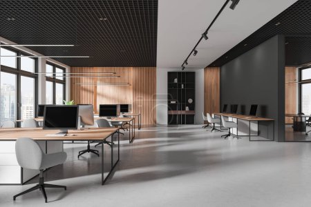 Photo for Office interior with pc computers on shared desks in row, light concrete floor. Minimalist coworking room with shelf, panoramic window on Singapore skyscrapers. 3D rendering - Royalty Free Image