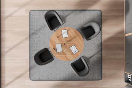 Top view of conference room interior with grey armchairs, clipboards on wooden meeting table, carpet on hardwood floor. Minimalist negotiation area with modern furniture. 3D rendering