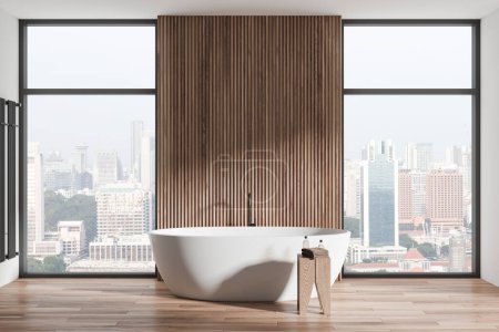 Téléchargez les photos : Une salle de bain moderne avec une baignoire autoportante, un mur en bois et un sol, donnant sur un fond de paysage urbain, symbolisant le design de la maison urbaine. Rendu 3D - en image libre de droit