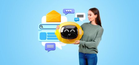 Foto de Smiling woman showing smiling AI chat bot, mockup blank cloud and web search, text messages on blue background. Concept of virtual assistant and machine learning - Imagen libre de derechos