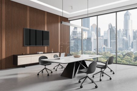Photo for Corner view of conference interior with table and chairs, tv screen and sideboard with decoration. Minimalist meeting room with panoramic window on Bangkok skyscrapers. 3D rendering - Royalty Free Image